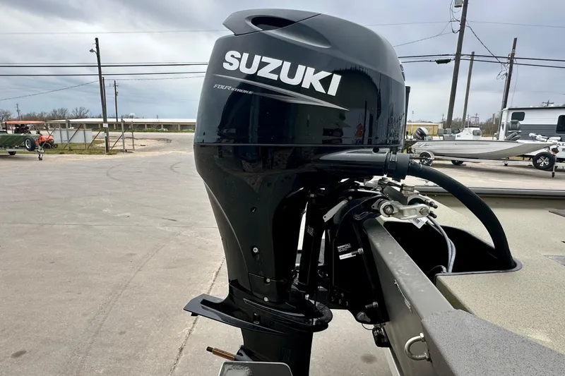 Slide: The Image of Outboard motor on 2026 SeaArk Shadow 17 boat, featuring Suzuki branding. - 6