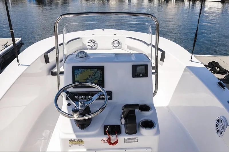 Slide: The Image of Manufacturer Provided Image: 2026 Tidewater 180 CC Adventure boat cruising on open water with two passengers. - 2