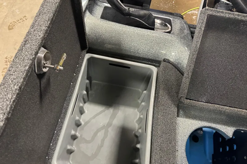 Slide: The Image of Interior compartment of a 2018 Nitro ZV21 boat, featuring storage and utility areas. - 11