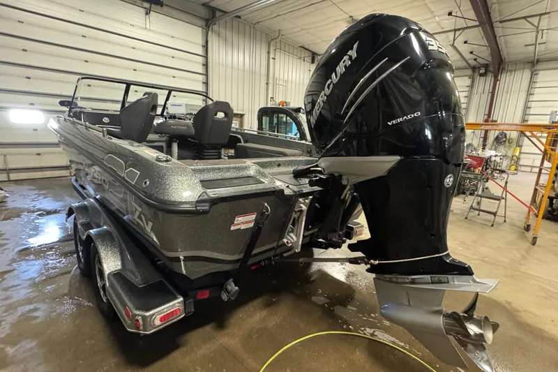 Slide: The Image of 2018 Nitro ZV21 boat with Mercury Verado engine in a garage setting. - 5