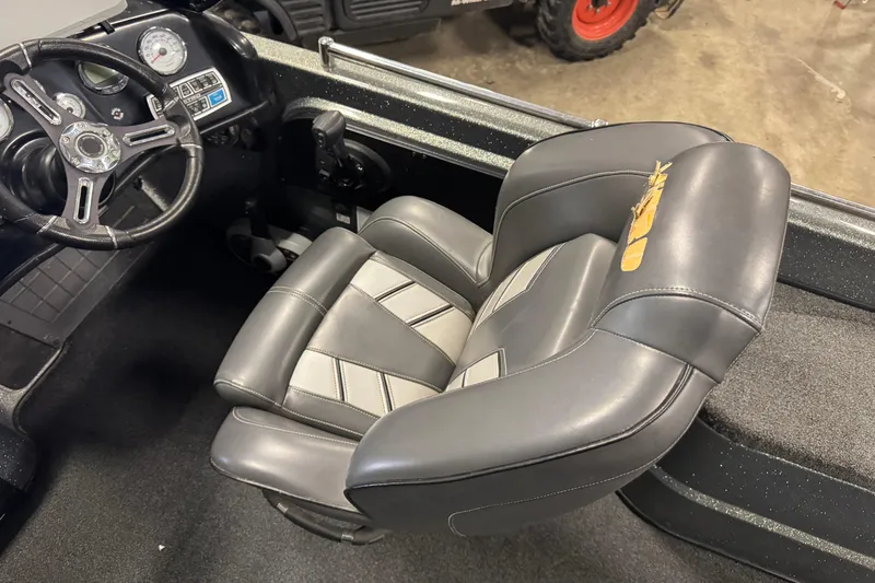 Slide: The Image of 2018 Nitro ZV21 boat interior with steering wheel and cushioned seat. - 8