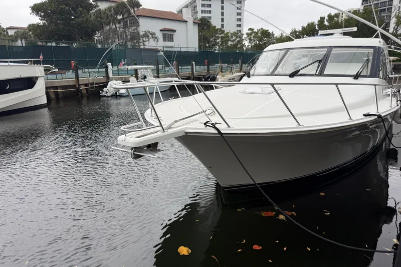 Slide: The Image of 2012 Cabo 40 Hardtop Express yacht docked in a marina. - 7