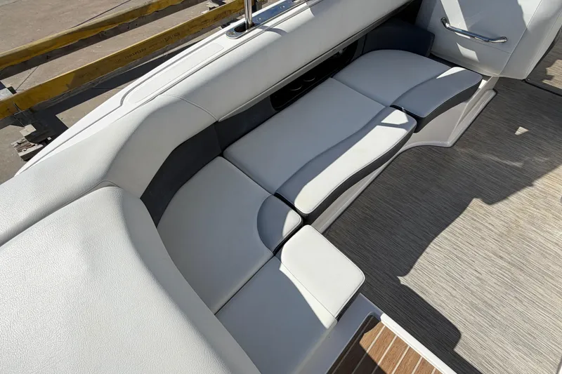 Slide: The Image of 2017 Regal 2700 ES Bowrider interior seating with light gray upholstery and sleek design. - 12
