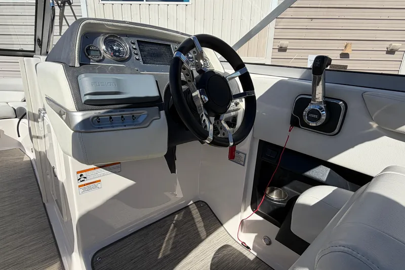 Slide: The Image of 2017 Regal 2700 ES Bowrider dashboard with steering wheel and controls. - 16