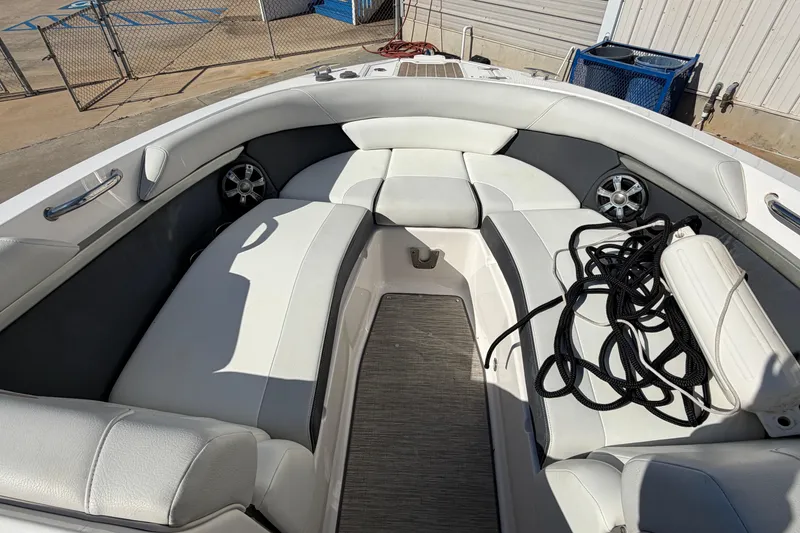 Slide: The Image of 2017 Regal 2700 ES Bowrider interior with white seating and coiled black rope. - 17