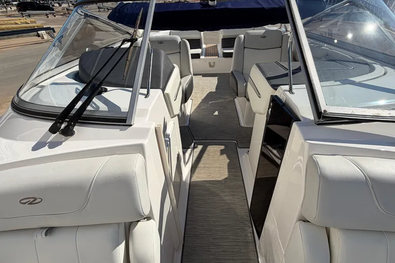 Slide: The Image of 2017 Regal 2700 ES Bowrider interior with white seating and open cockpit view. - 18