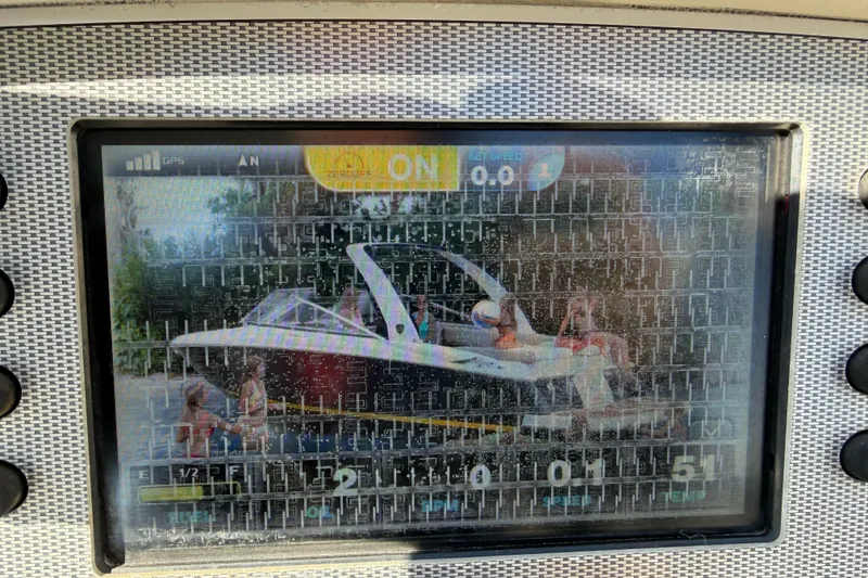 Slide: The Image of Display screen showing a 2017 Regal 2700 ES Bowrider boat with passengers onboard. - 21