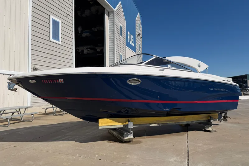 Slide: The Image of 2017 Regal 2700 ES Bowrider boat on display outside a storage facility. - 4