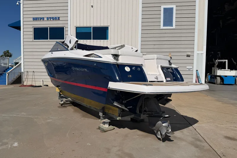 Slide: The Image of 2017 Regal 2700 ES Bowrider boat on dry dock near ship store. - 6