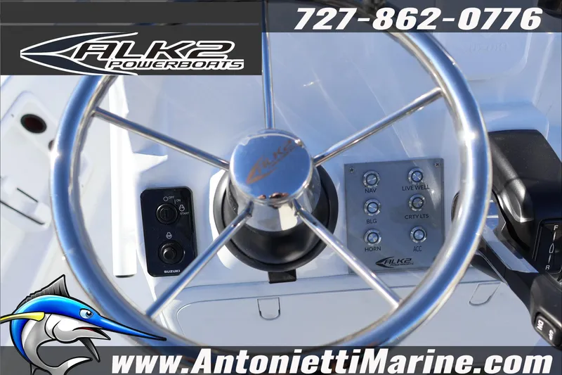 Slide: The Image of Steering wheel of 2026 ALK2 Powerboats 17HS with control panel and branding. - 15