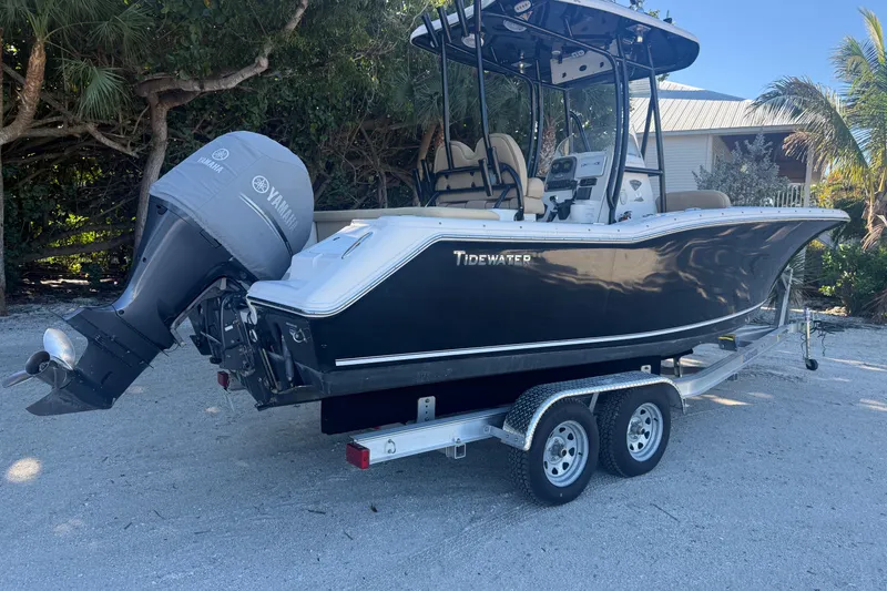 The Image of 2015 Tidewater 230 LXF boat on trailer with Yamaha outboard motor. - 1