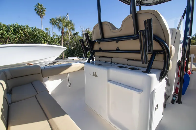 Slide: The Image of 2015 Tidewater 230 LXF boat interior with seating and rod holders. - 12