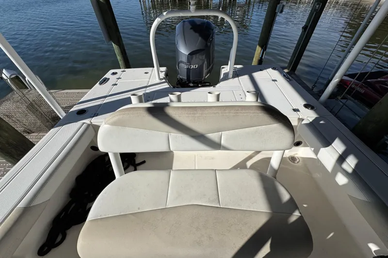 Slide: The Image of 2015 Robalo 246 Cayman boat interior with seating and Yamaha engine. - 20