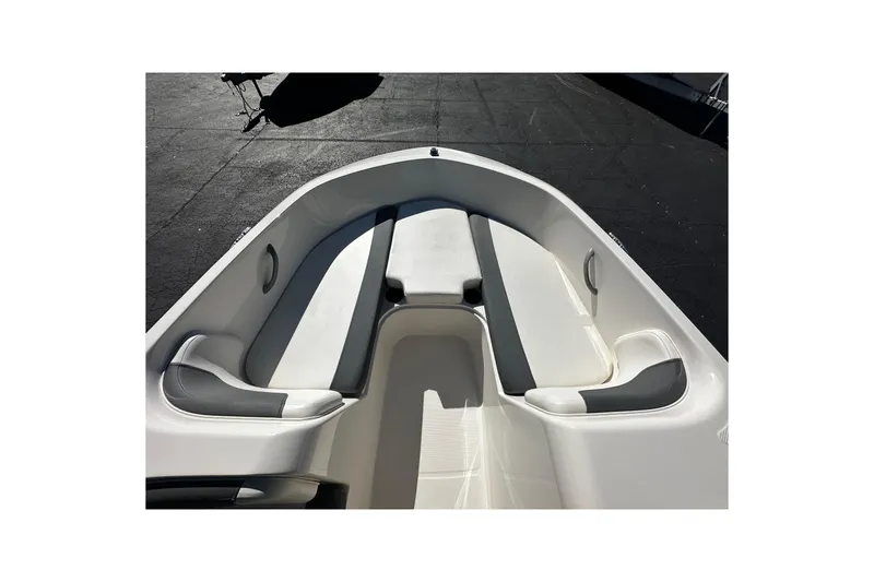Slide: The Image of 2021 Bayliner Element E18 boat interior with white and gray seating. - 7