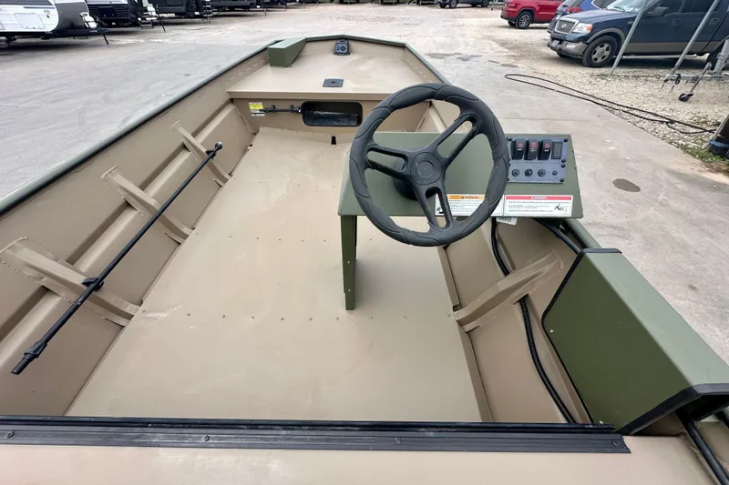 Slide: The Image of 2026 SeaArk 1652 Special boat interior with steering wheel and control panel. - 12