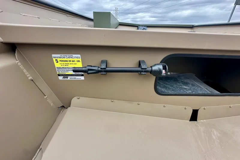 Slide: The Image of 2026 SeaArk 1652 Special boat interior, capacity label for 5 people or 641 lbs. - 15