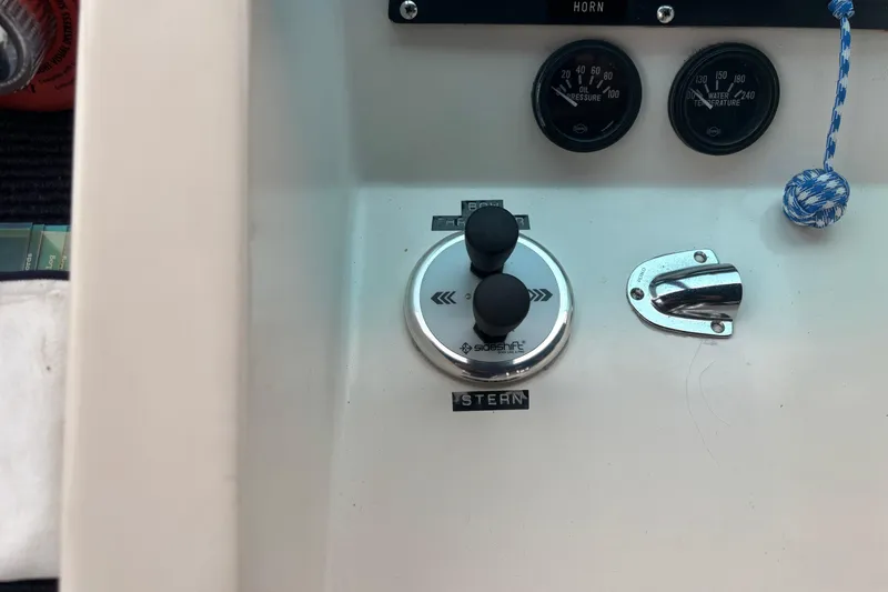 Slide: The Image of Control panel of a 1986 Ponderosa 42' boat with gauges and switches. - 10