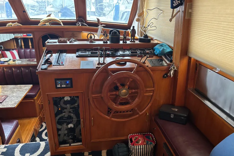 Slide: The Image of Interior of 1986 Ponderosa 42' yacht with wooden helm and nautical decor. - 20