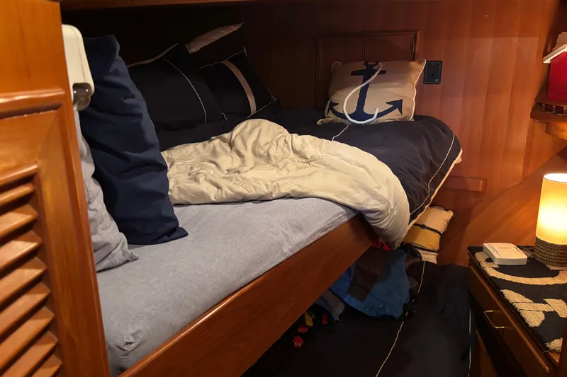 Slide: The Image of Cozy cabin interior of 1986 Ponderosa 42' yacht with nautical-themed bedding. - 21