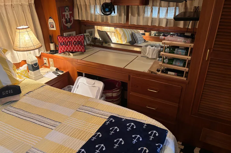 Slide: The Image of Cozy cabin interior of 1986 Ponderosa 42' yacht with nautical decor and wooden furnishings. - 27