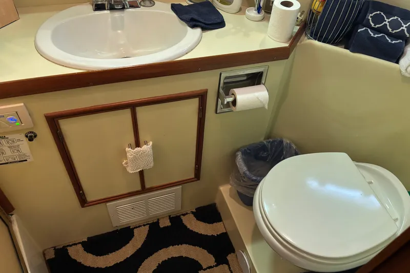 Slide: The Image of Bathroom interior of a 1986 Ponderosa 42' boat with sink and toilet. - 28