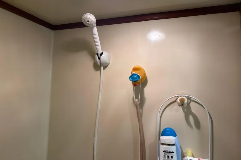 Slide: The Image of Shower area in 1986 Ponderosa 42' boat with toiletries and showerhead. - 29