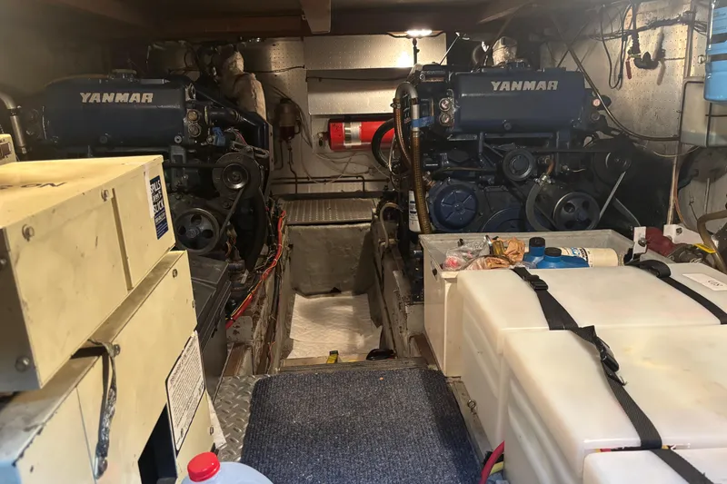 Slide: The Image of Engine room of a 1986 Ponderosa 42' boat with dual Yanmar engines. - 31