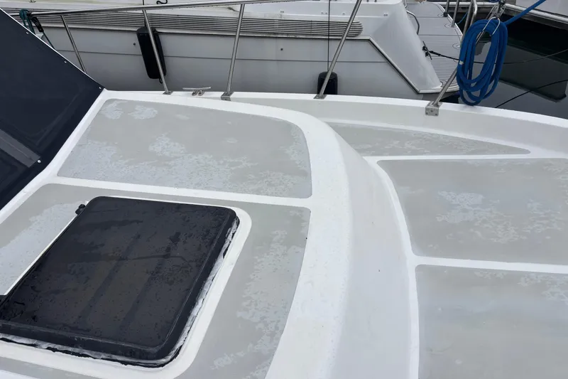 Slide: The Image of 1986 Ponderosa 42' yacht deck with hatch, docked at marina. - 7