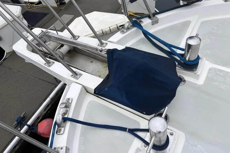 Slide: The Image of 1986 Ponderosa 42' yacht deck with blue ropes and covered equipment. - 8