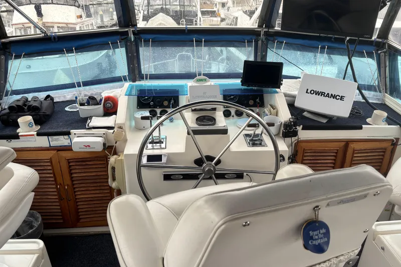 Slide: The Image of Cockpit of 1986 Ponderosa 42' boat with steering wheel and navigation equipment. - 9