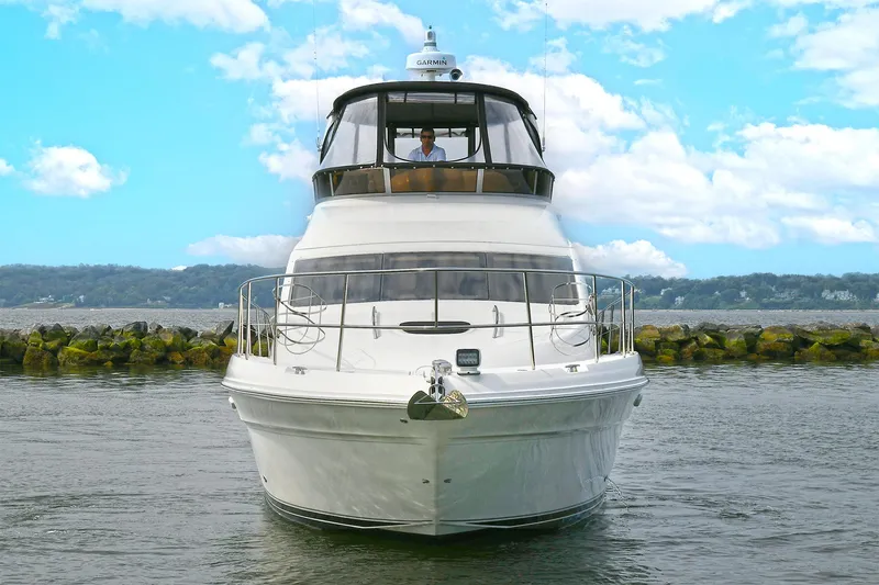 Slide: The Image of 2008 Sea Ray 44 Sedan Bridge yacht on calm waters. - 1