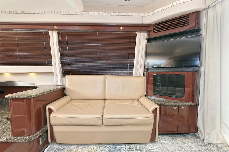 Slide: The Image of Interior of 2008 Sea Ray 44 Sedan Bridge with sofa and TV. - 19