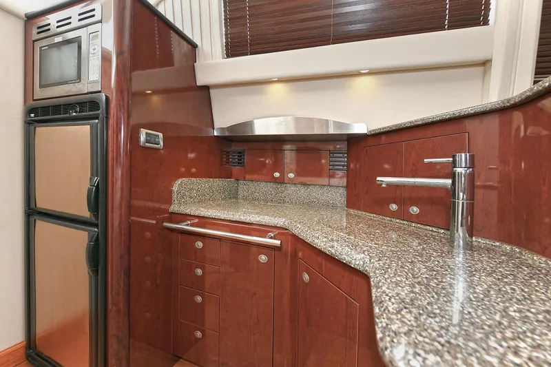 Slide: The Image of Luxurious kitchen on a 2008 Sea Ray 44 Sedan Bridge yacht. - 30