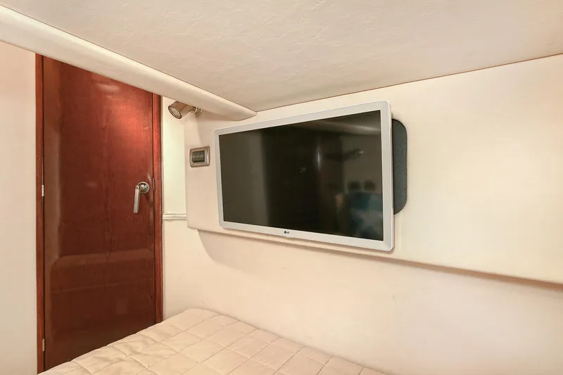 Slide: The Image of Interior of 2008 Sea Ray 44 Sedan Bridge with flat-screen TV. - 43