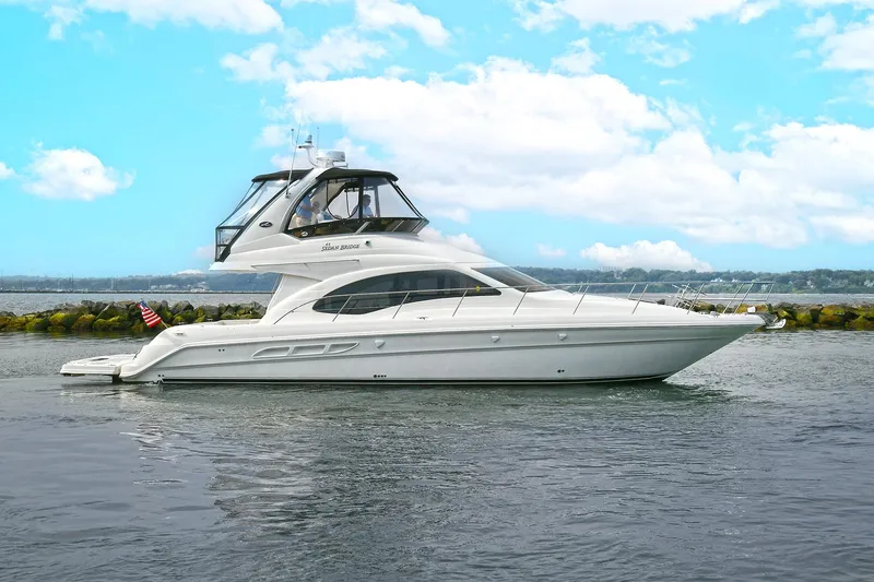 Slide: The Image of 2008 Sea Ray 44 Sedan Bridge on calm waters. - 8