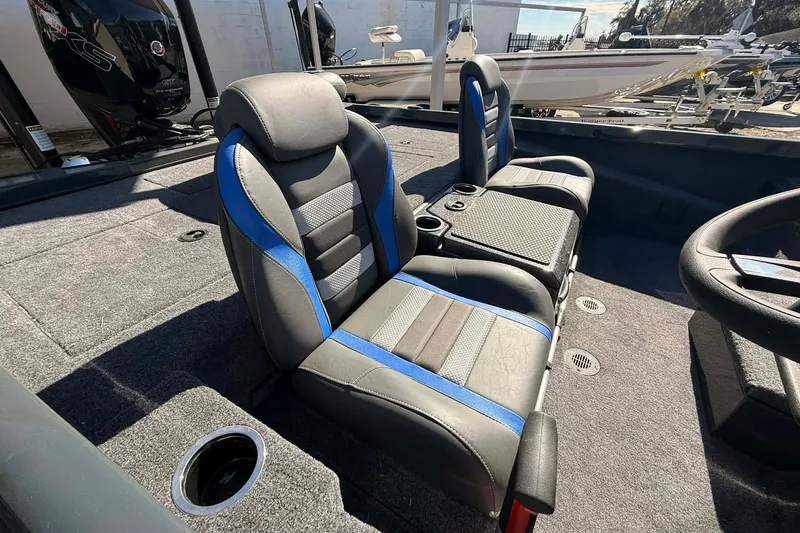 Slide: The Image of 2026 Ranger RT188P boat interior with dual seats and steering wheel. - 2