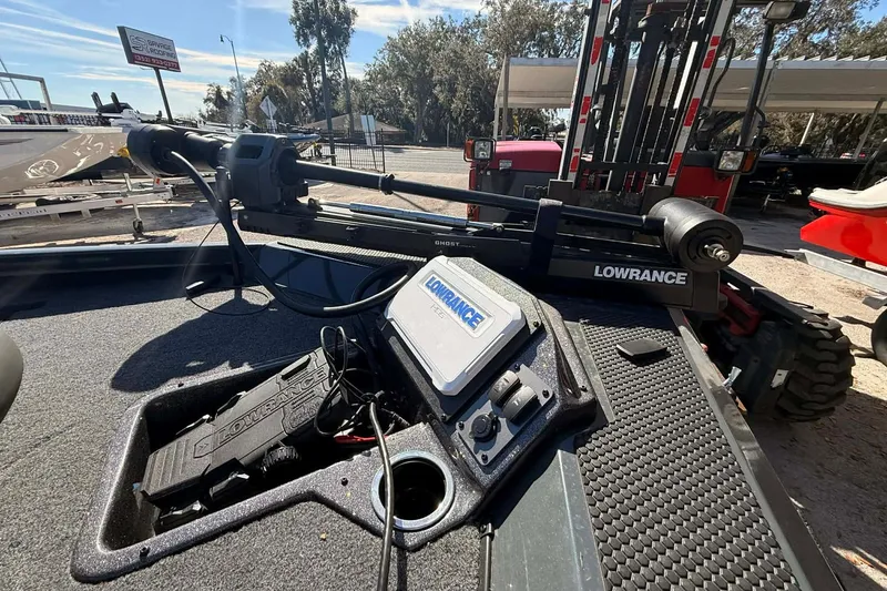 Slide: The Image of 2026 Ranger RT188P boat with Lowrance equipment, parked outdoors under clear skies. - 5