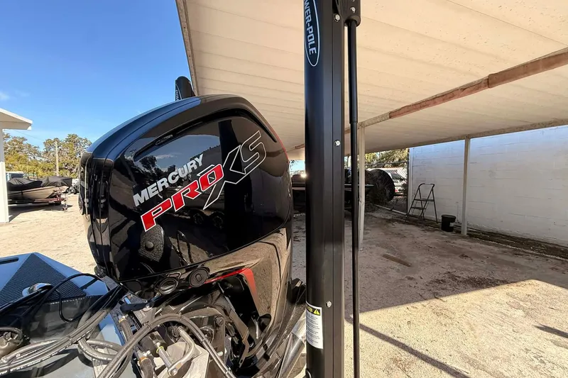 Slide: The Image of 2026 Ranger RT188P with Mercury Pro XS engine under a covered area. - 8