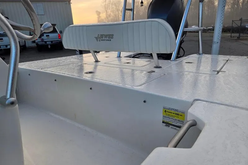 Slide: The Image of 2014 Hewes Redfisher 18 boat interior with seating and storage compartments. - 8