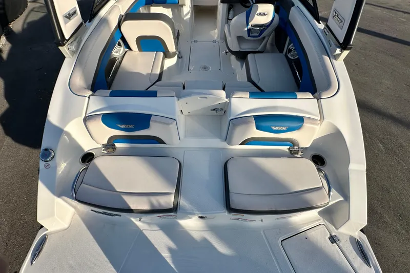 Slide: The Image of 2017 Chaparral Vortex 203 VRX boat interior with blue and white seating. - 11