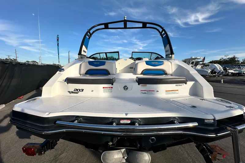Slide: The Image of 2017 Chaparral Vortex 203 VRX boat, rear view, showcasing sleek design and seating. - 4