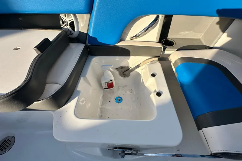 Slide: The Image of 2017 Chaparral Vortex 203 VRX boat interior with sink and blue seating. - 53