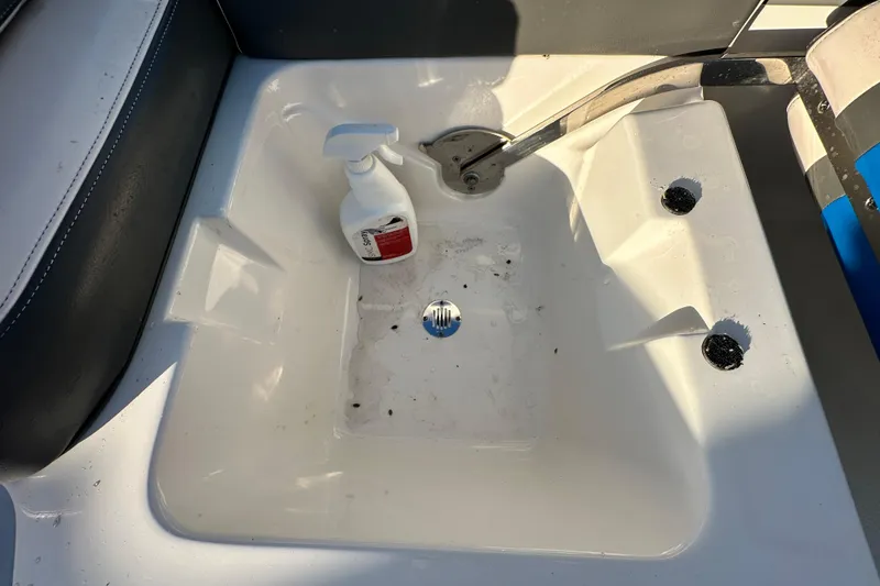 Slide: The Image of 2017 Chaparral Vortex 203 VRX boat sink with cleaning spray bottle. - 54