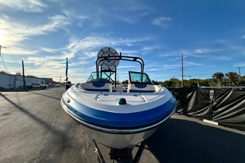 Slide: The Image of 2017 Chaparral Vortex 203 VRX boat on trailer under clear blue sky. - 9