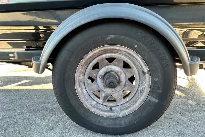 Slide: The Image of 2017 Chaparral Vortex 203 VRX trailer wheel with Karrie tire on pavement. - 91