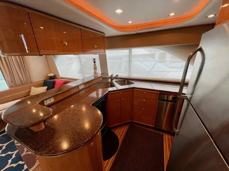 Slide: The Image of Luxurious kitchen in 2002 Bayliner 5788 yacht with modern appliances and sleek design. - 17