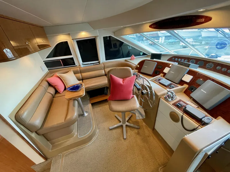 Slide: The Image of 2002 Bayliner 5788 yacht interior with helm, seating, and navigation equipment. - 27