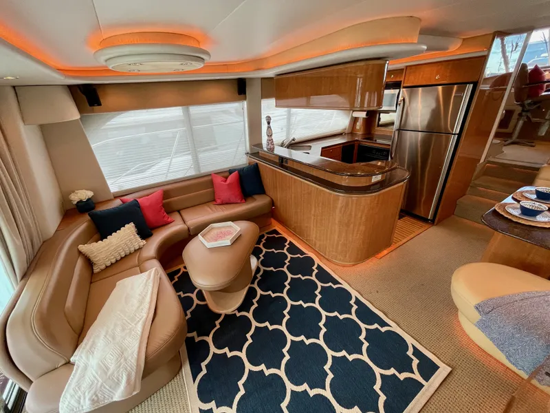 Slide: The Image of Luxurious interior of 2002 Bayliner 5788 yacht with modern kitchen and cozy seating area. - 4