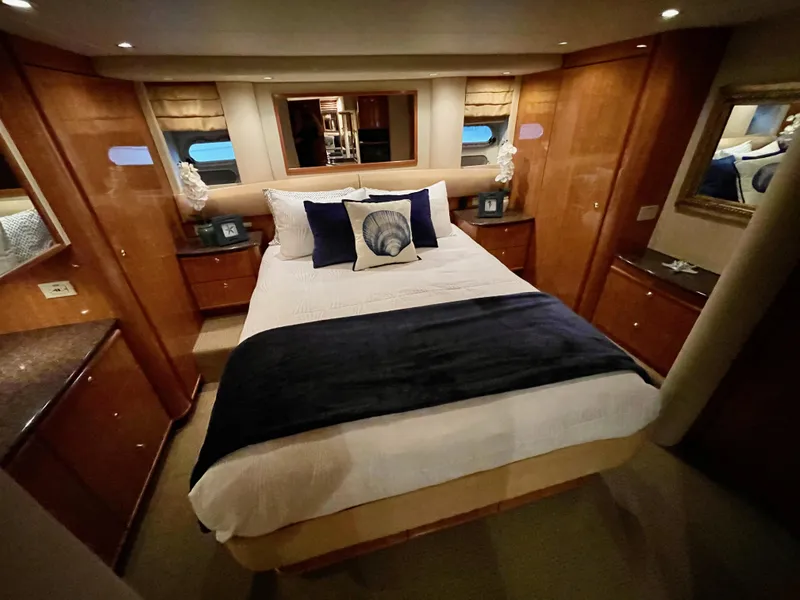 Slide: The Image of Luxurious bedroom interior of 2002 Bayliner 5788 yacht with elegant decor and comfortable bedding. - 43