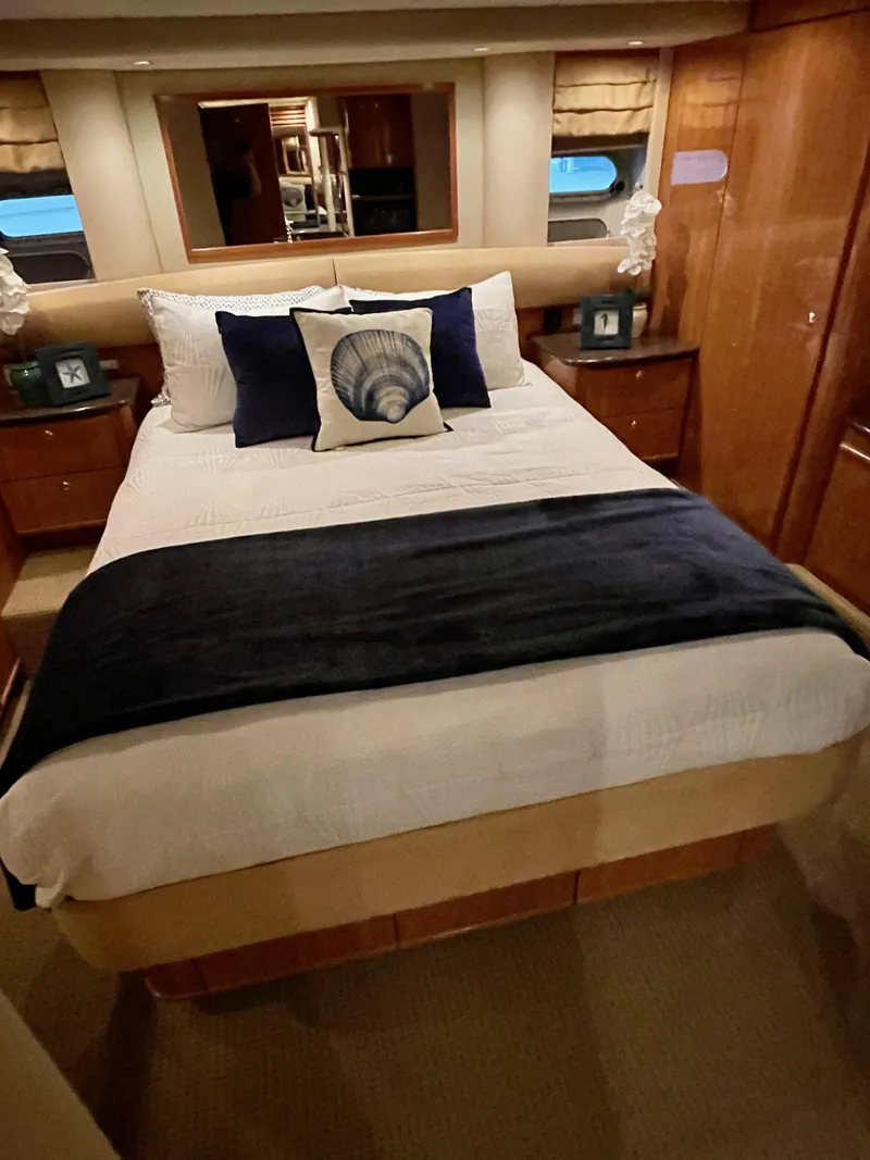 Slide: The Image of Luxurious bedroom interior of a 2002 Bayliner 5788 yacht with elegant bedding. - 45